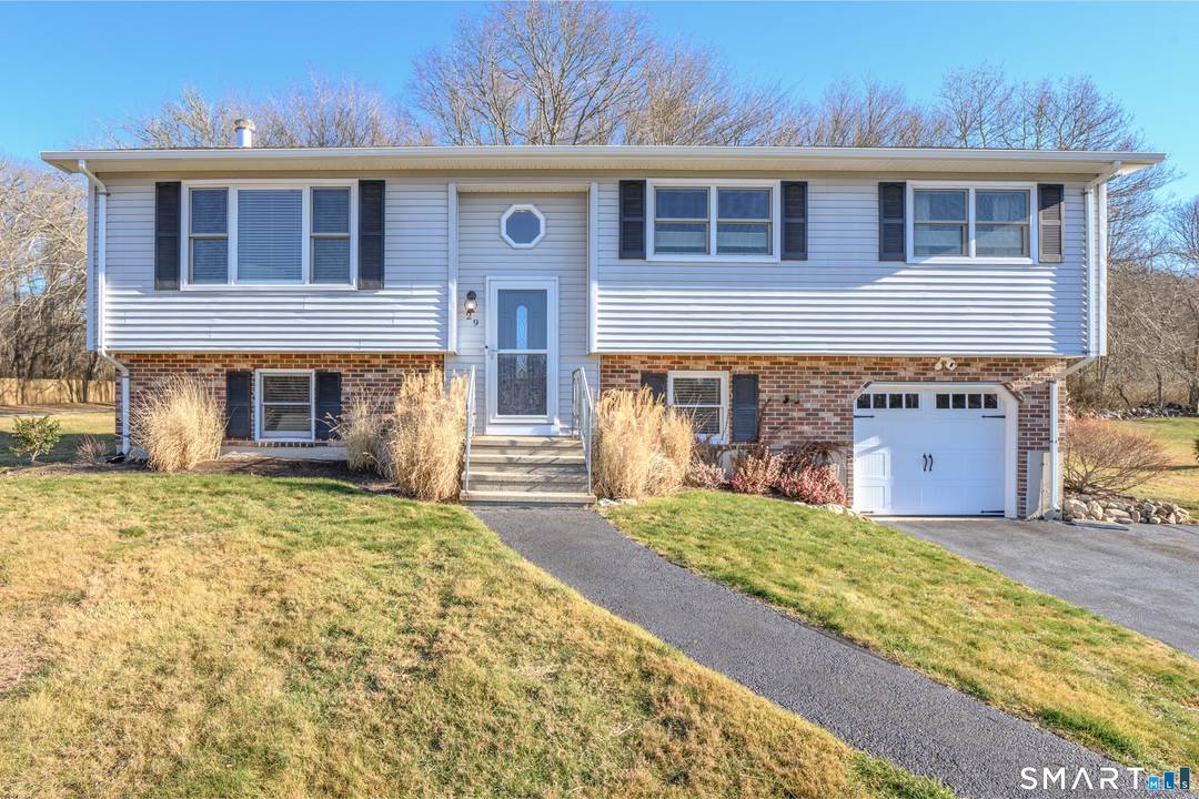 Just minutes from the heart of Mystic, this meticulously maintained Raised Ranch on.