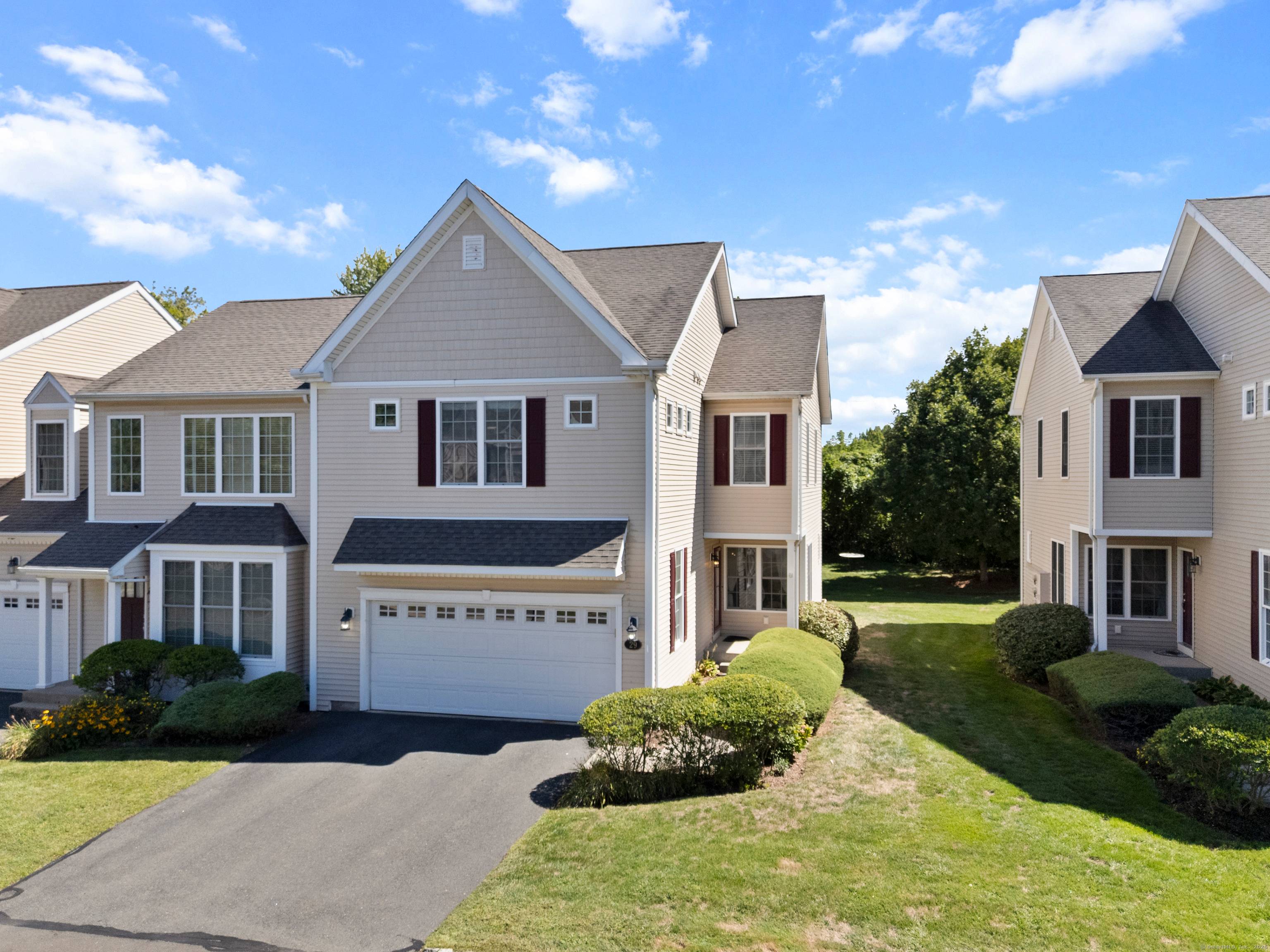 Fall in love with this beautifully maintained end unit townhome in the highly sought after Newington Ridge community, built by Toll Brothers.
