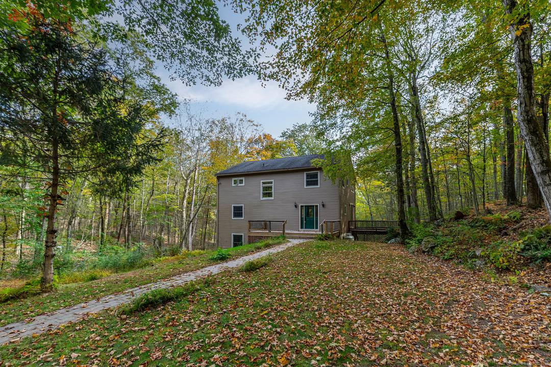 Tucked away on a long private road, this light and bright Roxbury retreat combines timeless character with modern comfort.