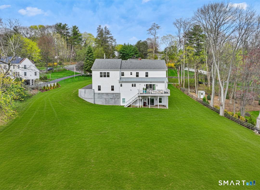 Set on a crescent shaped quiet street with serene seasonal water views, this stunning 2023 built home offers the perfect blend of modern elegance and comfortable living.