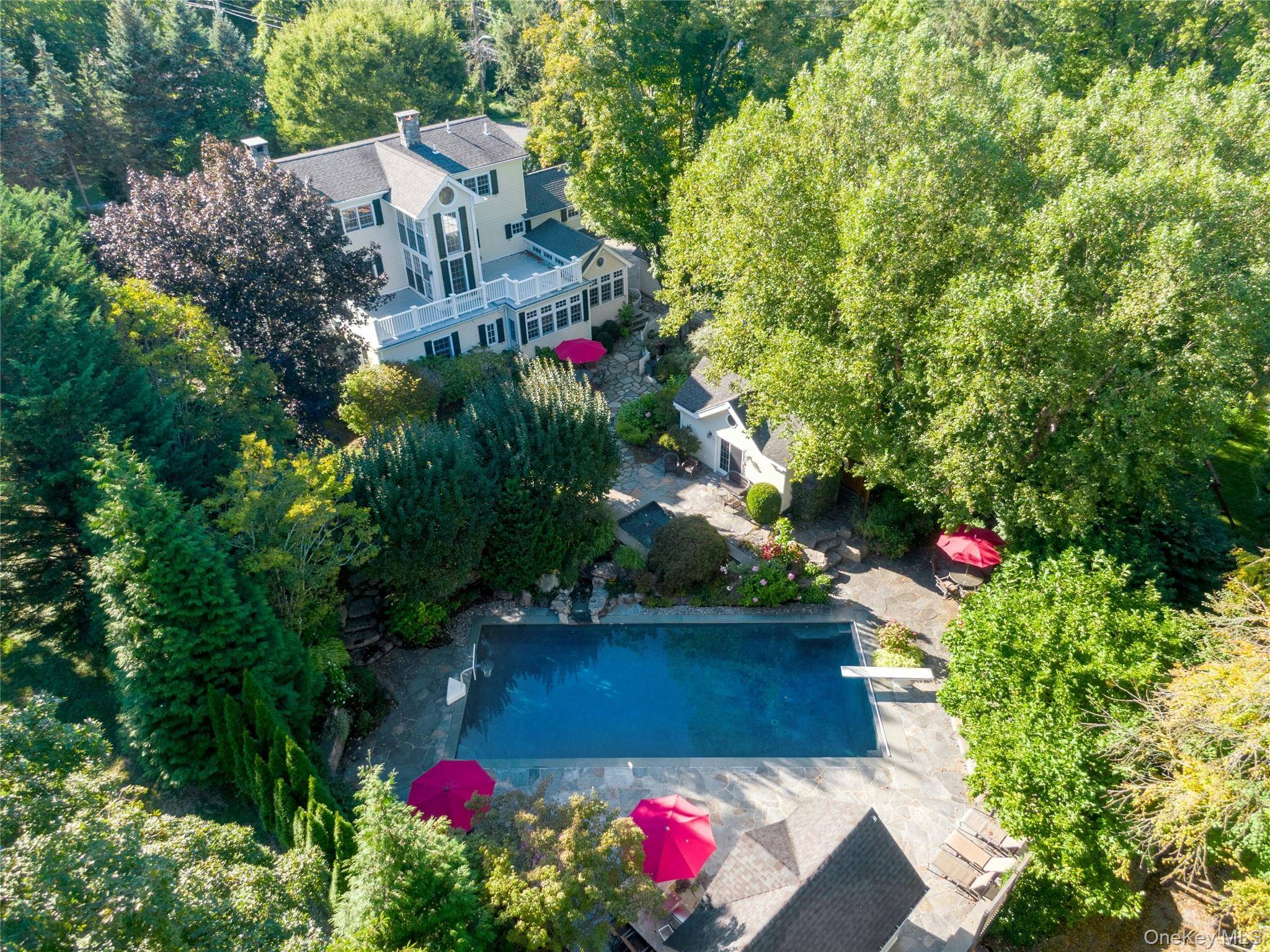 Like a masterly crafted engaging jewel this grand 1927 Colonial farmhouse reveals delightful surprises at every turn.