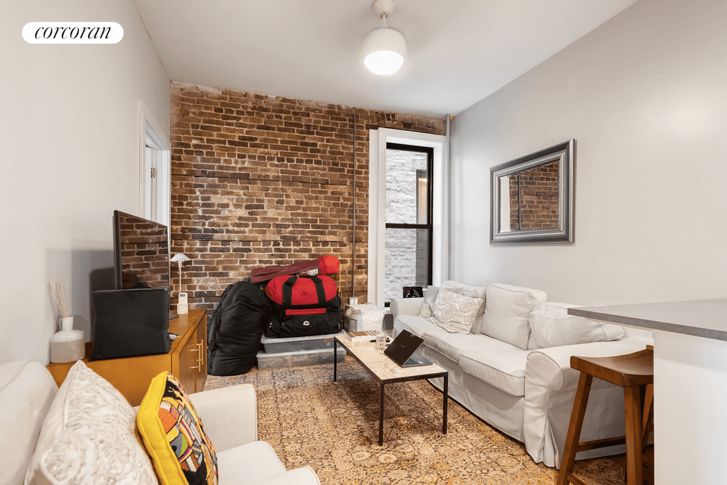 Located on the second floor of a lovely four story brick building, Apartment 4 features two spacious bedrooms, 9'2 ceilings and exposed brick.