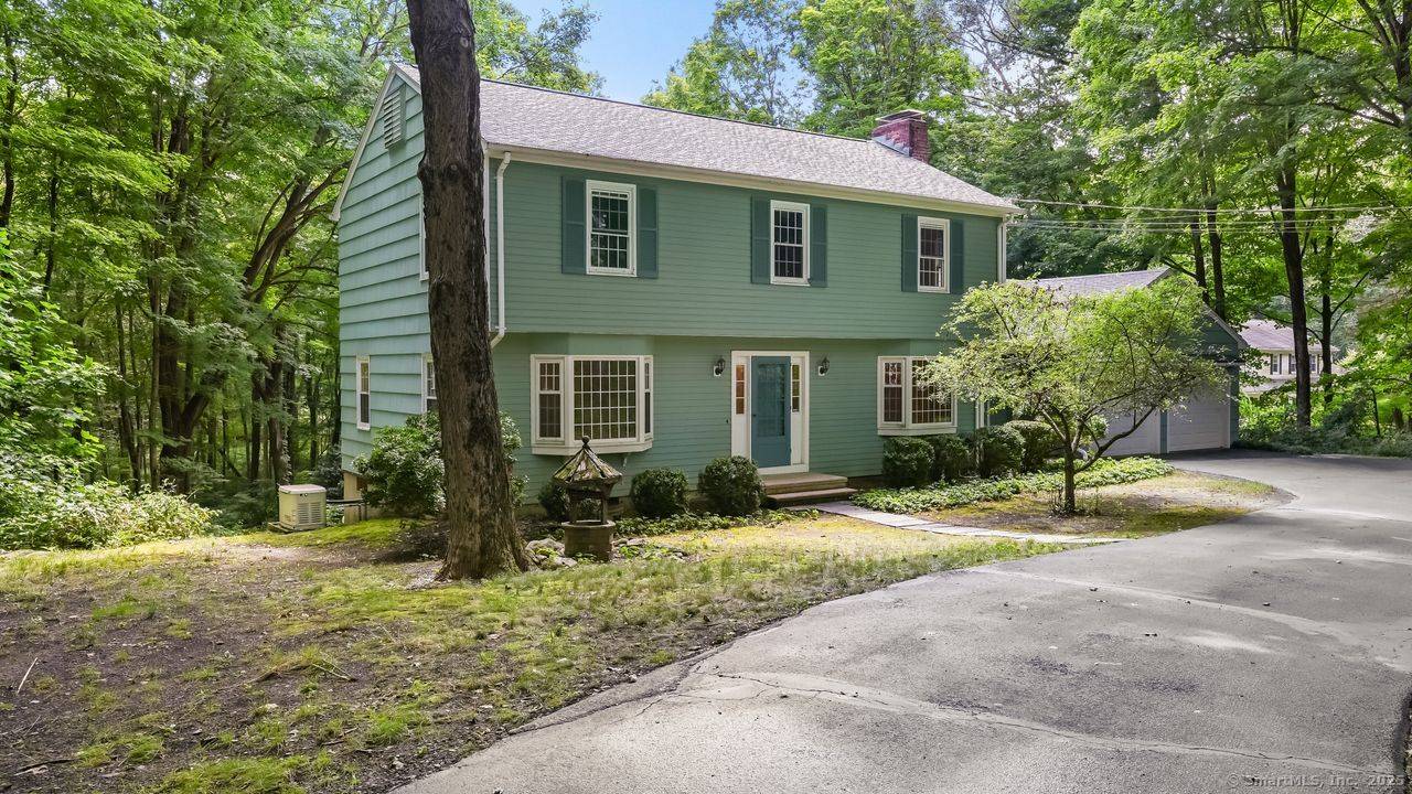 Set back from the road and surrounded by nature, this beautifully updated 4 bedroom, 3.