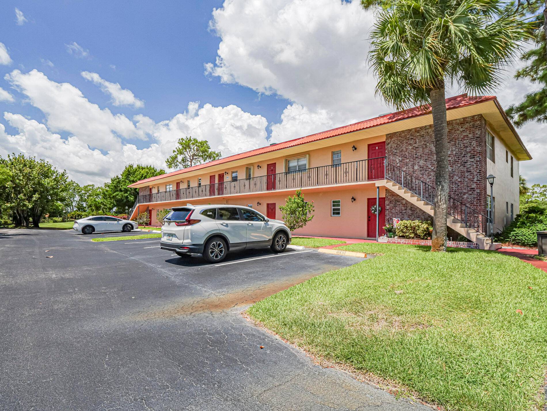 Completely redone with tile floors throughout, updated kitchen with newer appliances, impact windows on lanai overlooking grounds.