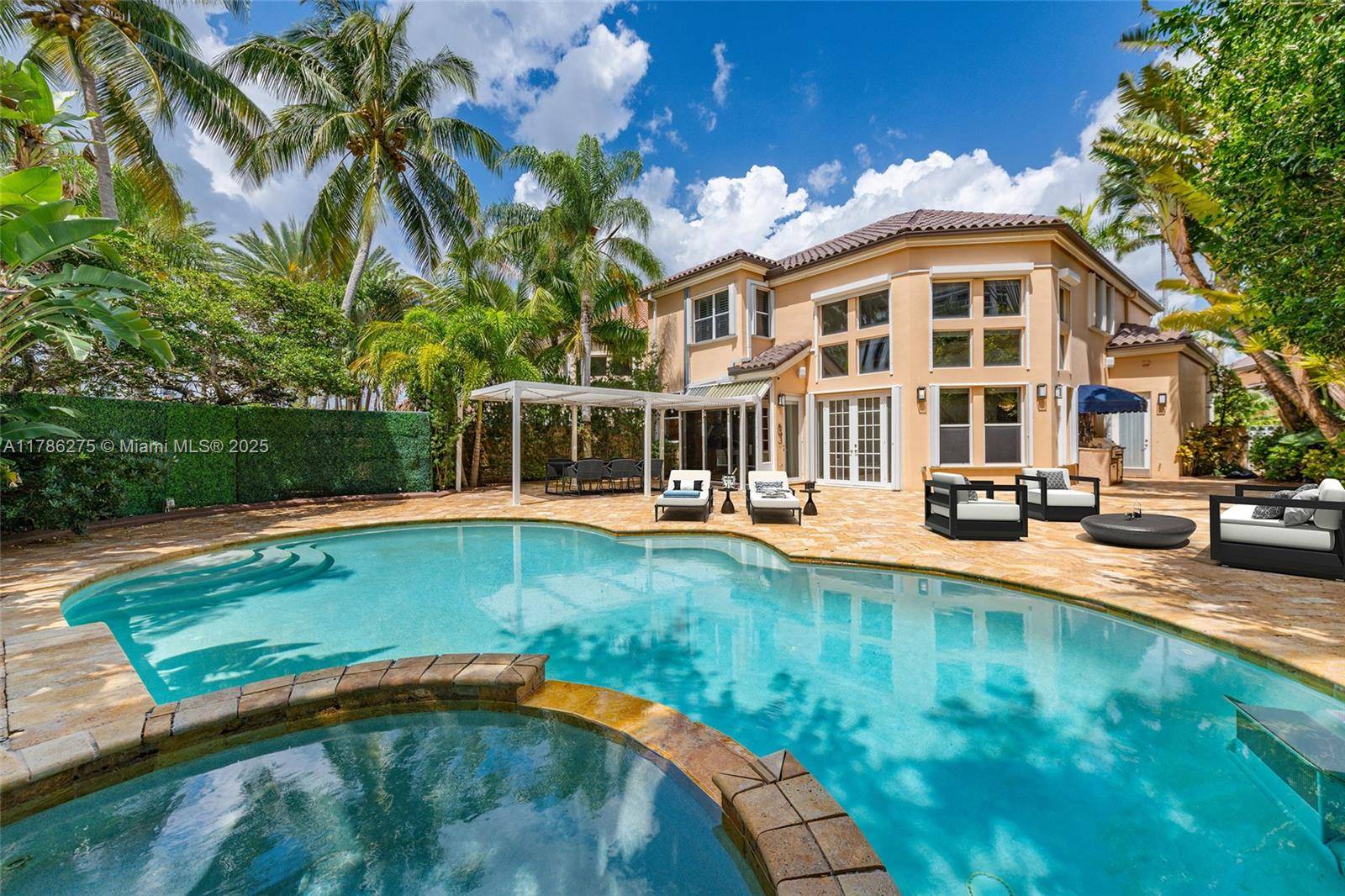 Nestled in the exclusive gated community of Island Way, this stunning single family home offers the perfect blend of comfort, elegance, and outdoor luxury.