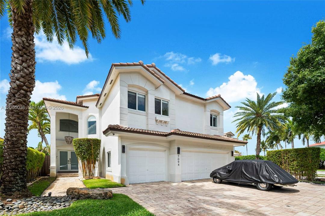 Light filled 2 story home w relaxing views to the pristine pool amp ; lake in highly desired Doral Isles.
