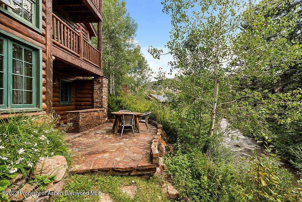 Discover this exceptional once in a generation property nestled on a serene 1 acre plot along the tranquil banks of Capitol Creek in Old Snowmass.