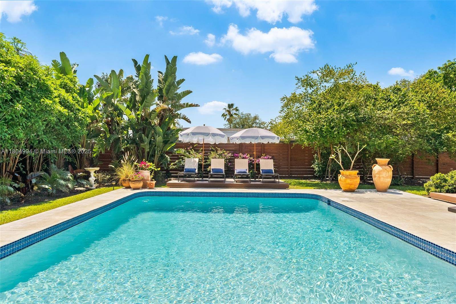 South Florida Dream Life Just 2 miles from the beach, this professionally designed retreat in Coral Heights delivers luxury, comfort, privacy amp ; location.