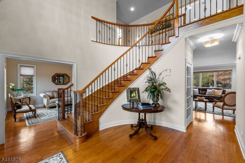 Located in desirable Harding Township, this impressive 5 bedroom, 5 full and 1 half bath home offers around 5, 000 square feet of living space and the perfect balance of ...