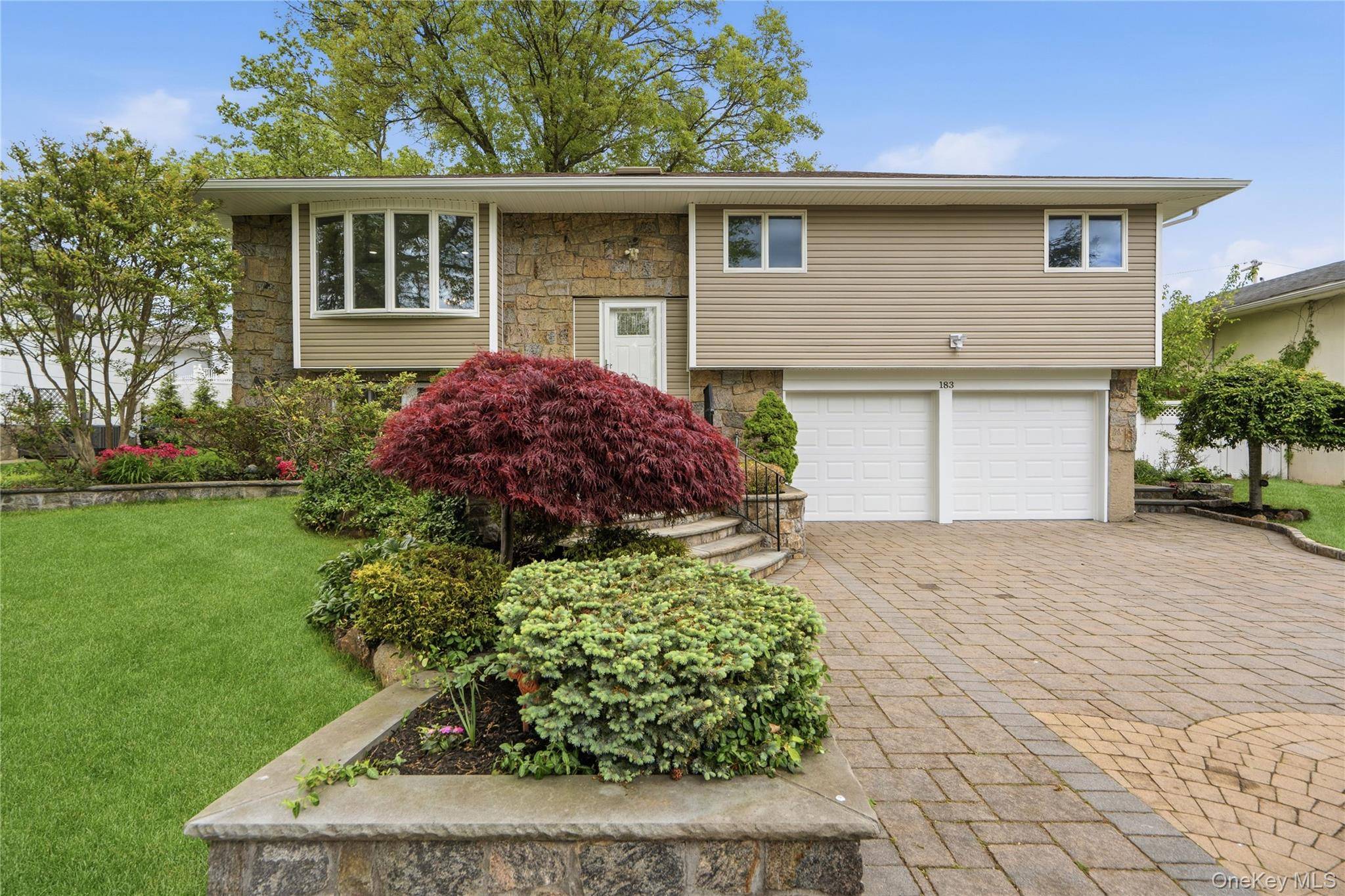 Welcome to this Beautiful and Completely Renovated Hi Ranch, Ideally Located in the Jericho School District.