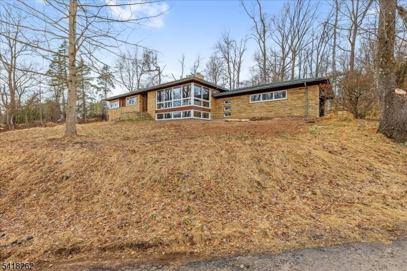 Discover a rare opportunity to own a unique Mid Century Modern retreat set high on over 17 private acres in beautiful Skillman.