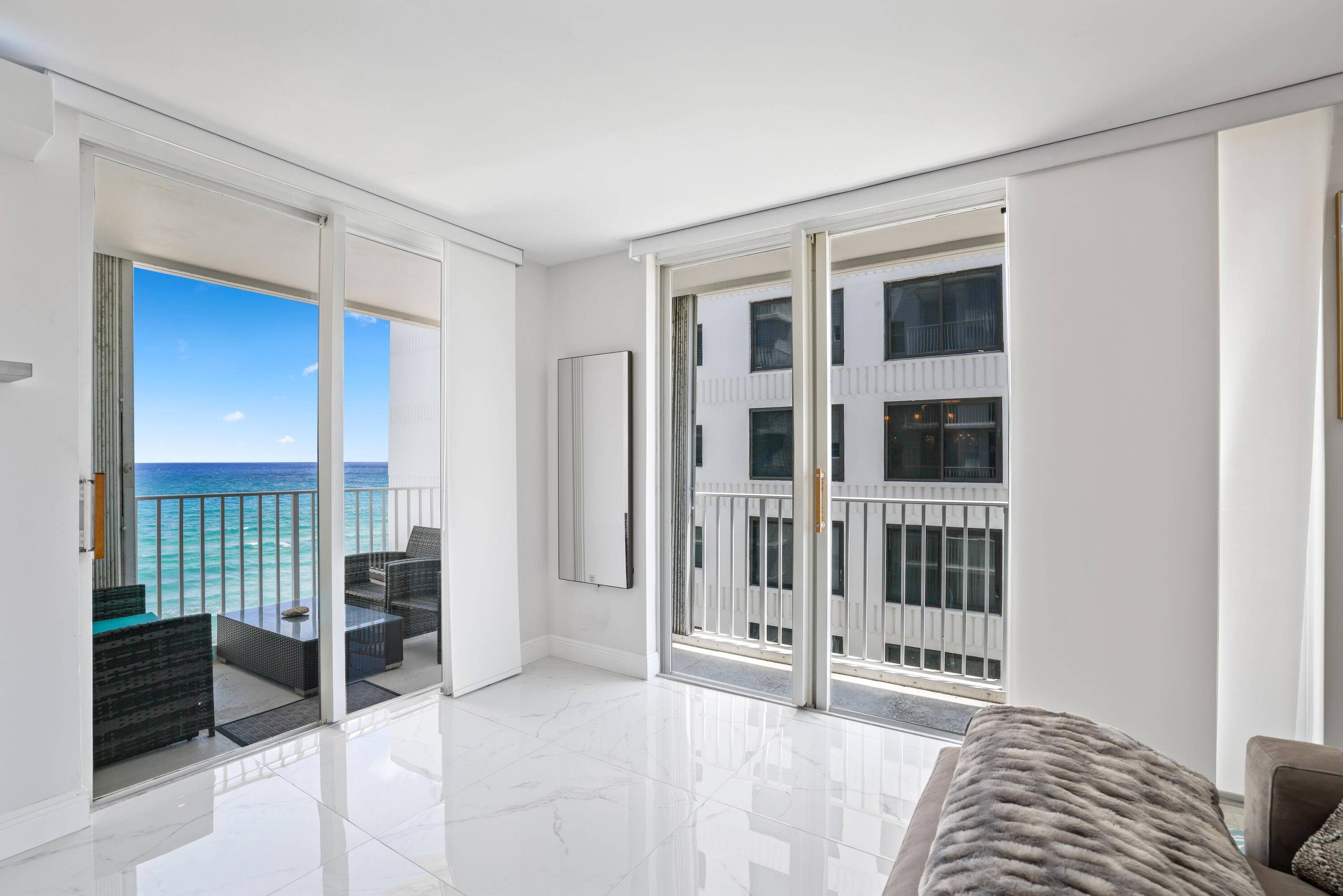 LIVE THE BEACH LIFE ! Fully furnished, renovated oceanfront condo with direct beach access.