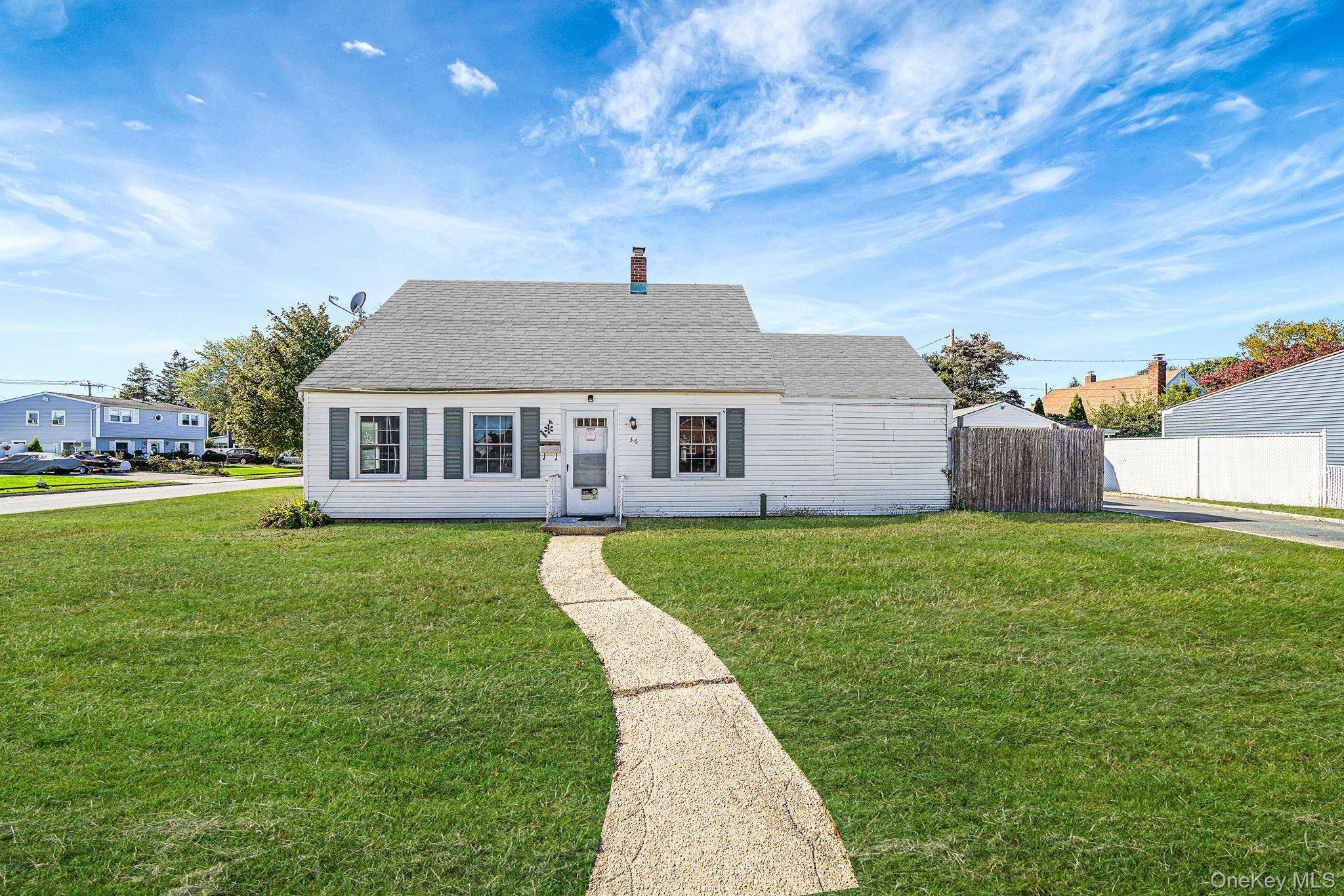 Charming 4 bedroom, 1 bath Levitt Cape situated on a desirable corner property.