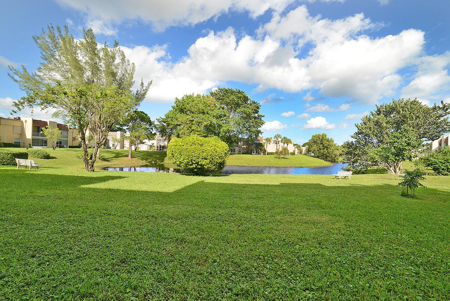 VERY DESIRABLE CENTER DELRAY LOCATION AMONG SEAGATE CC DELRAY PUBLIC GOLF COURSE BEAUTIFULLY REMODELED, FRESHLY PAINTED 1ST FL HOME WITH SERENE LAKE VIEWS INVESTORS, PETS ALL AGES WELCOME !