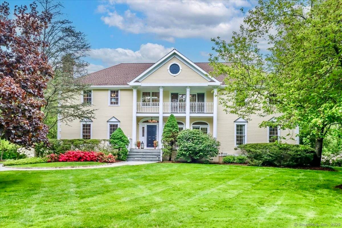 Nestled on a coveted, serene cul de sac in Wilton, this 5 bedroom, 4.
