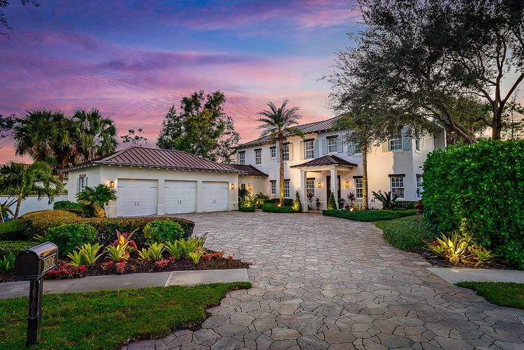 Discover elevated waterfront living in Old Cypress Point, a private gated enclave offering exceptional privacy.