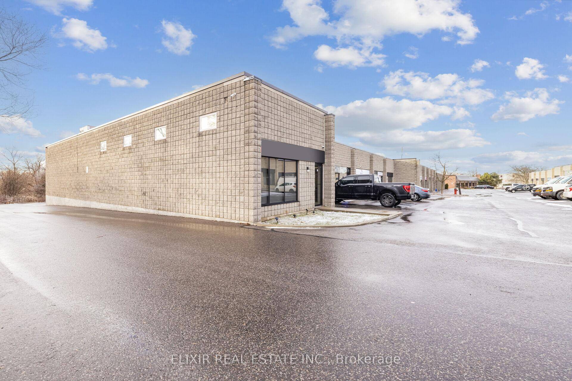 Fully Renovated End Unit Industrial Condo in Prime Aurora Location !