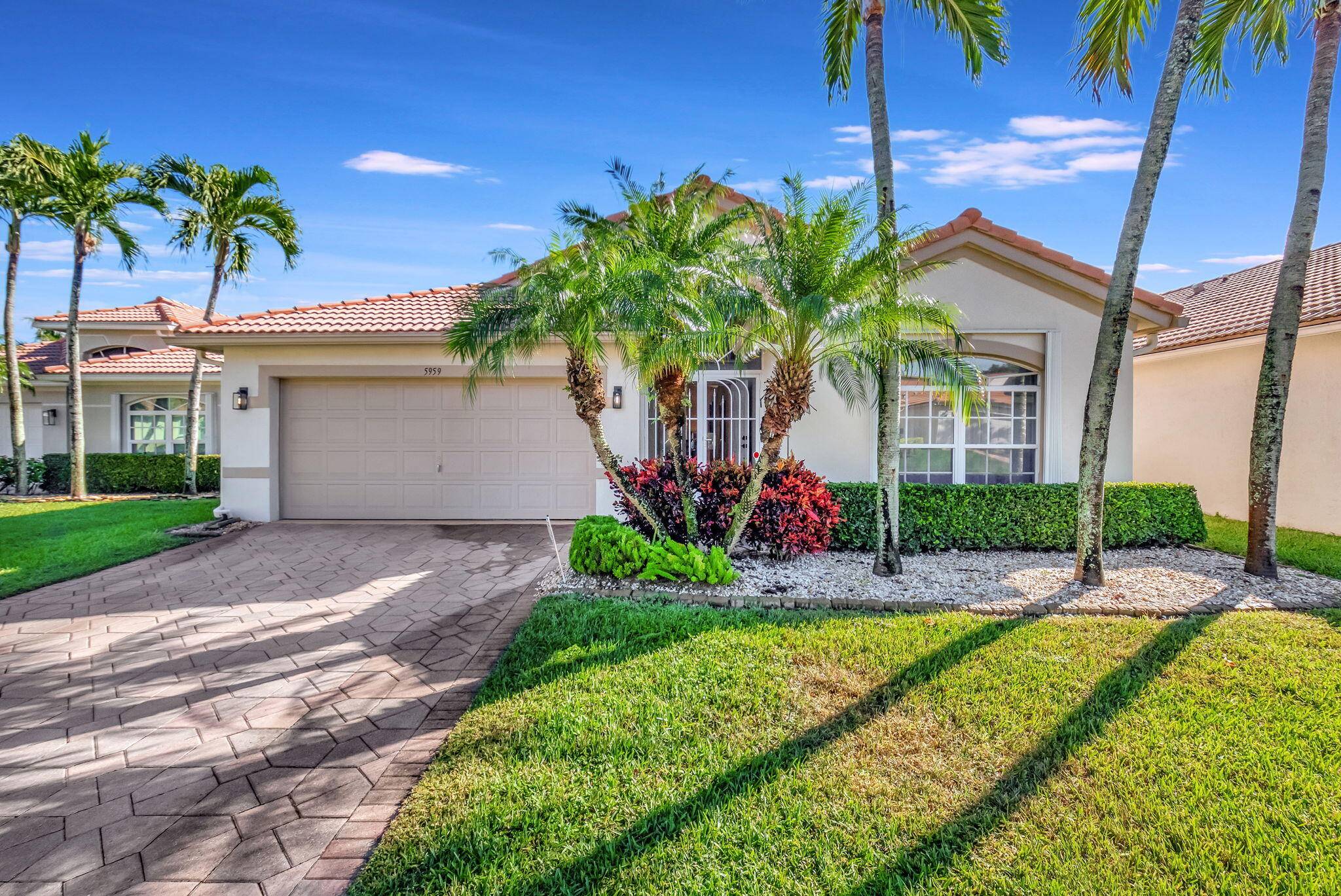 Watch the sunrise wildlife from this beautifully maintained LAKEFRONT 3 2 home located in active 55 age restricted gated community of Royal Lakes.