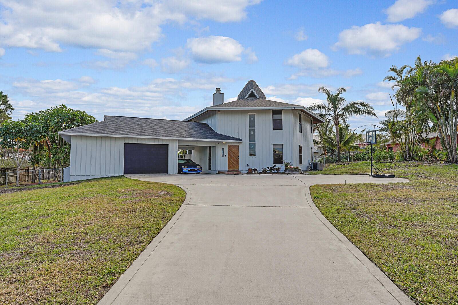 Nestled on a huge lot on the scenic bluffs of Hobe Sound, this stunning custom built 4 2 home with New Roof in the prestigious Papaya Village offers a perfect ...