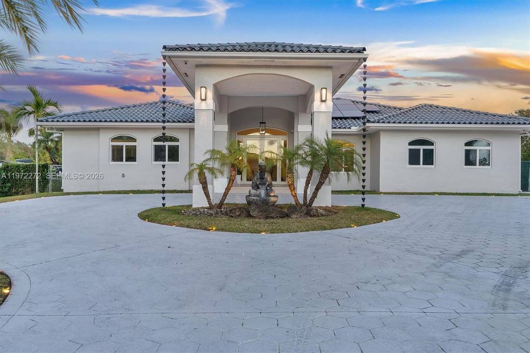 Situated on a rare one acre lot in Sweetwater Estates, this fully remodeled home offers five bedrooms and four bathrooms, filled with bright, open living spaces.