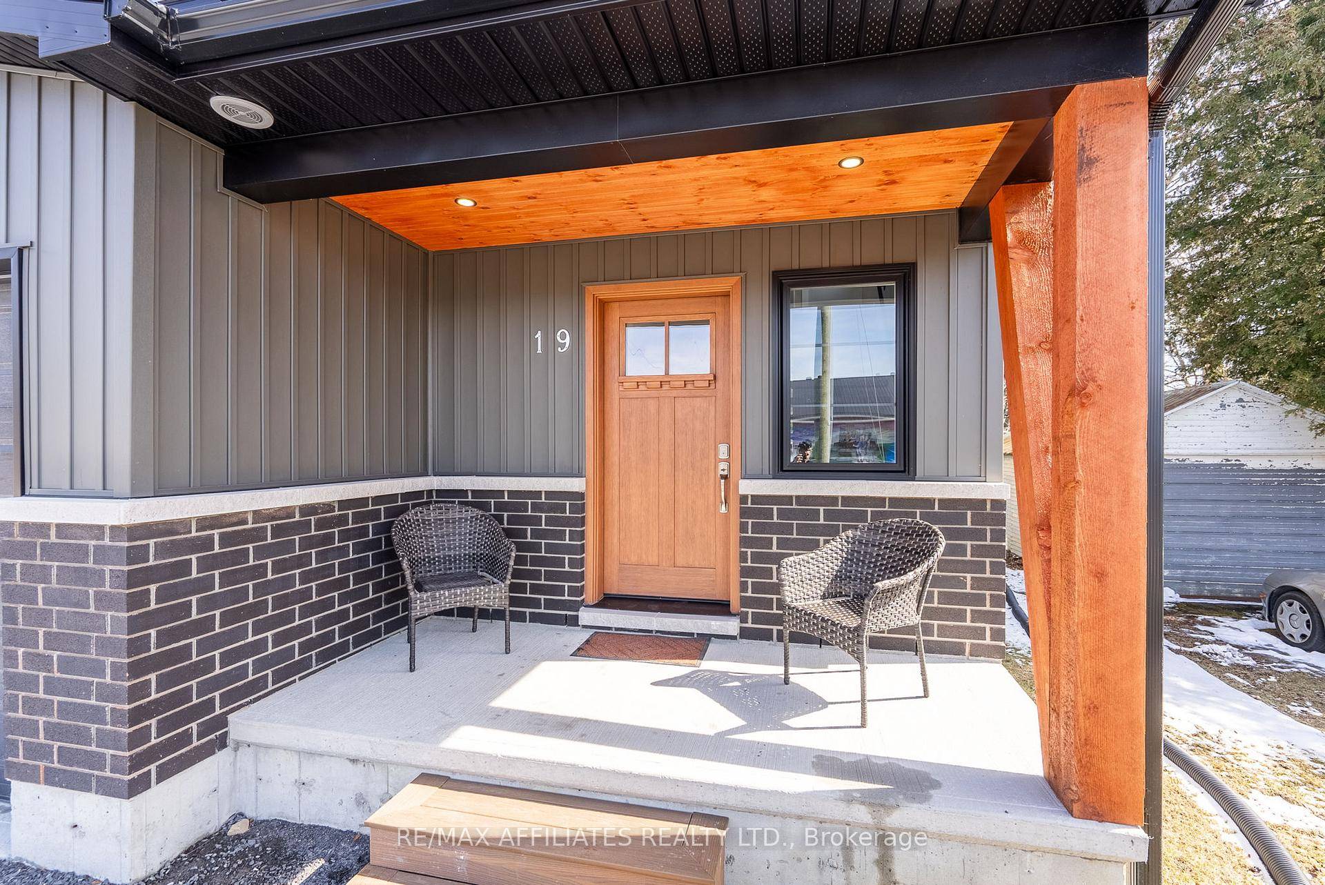 Stunning, newly built end unit townhouse with exceptional curb appeal !