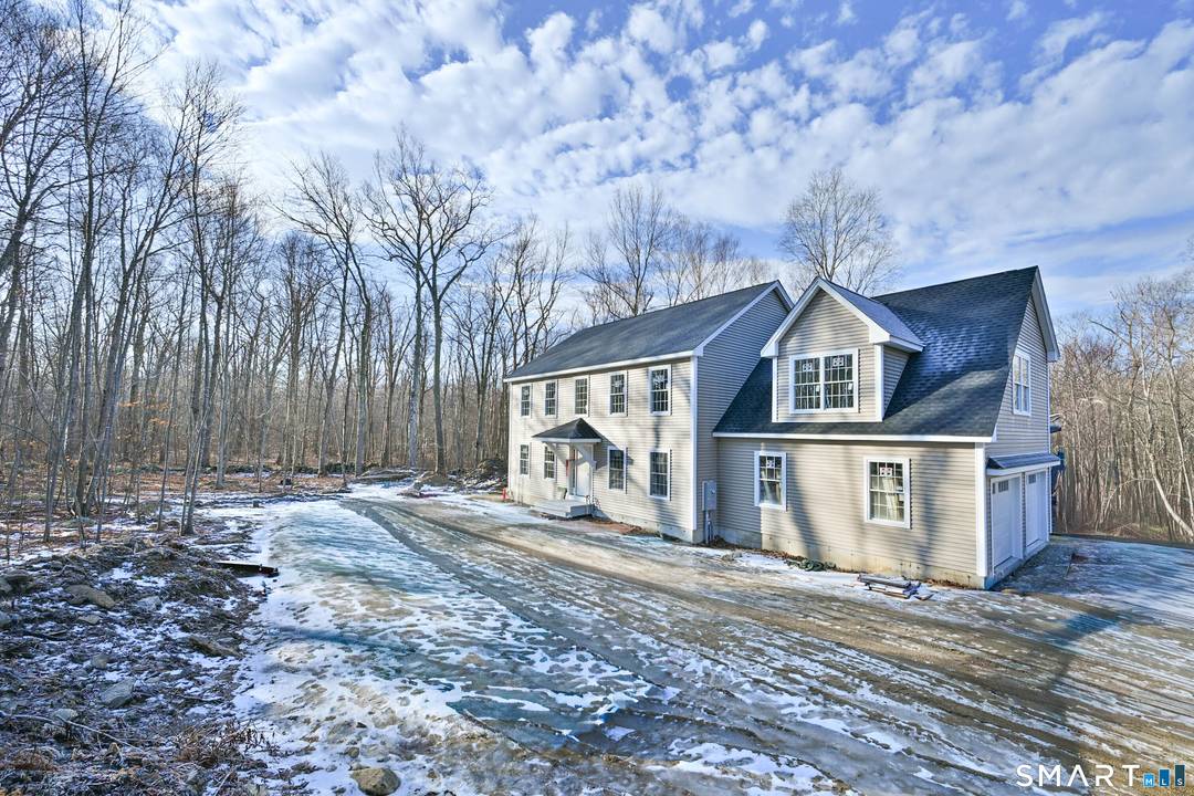 Set on a dead end road abutting the Brooklyn border, 401 Tripp Hollow is a refined new construction Colonial by one of the area's most premier builders.