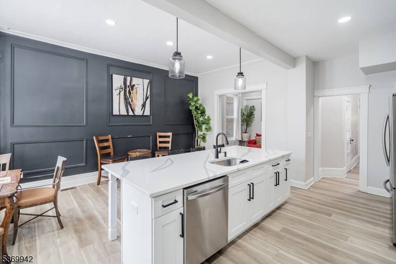 The perfect blend of historic elegance comfort in this beautifully renovated 5 bedroom, 3 bathroom brownstone, ideally situated on the border of Greenville and West Bergen.