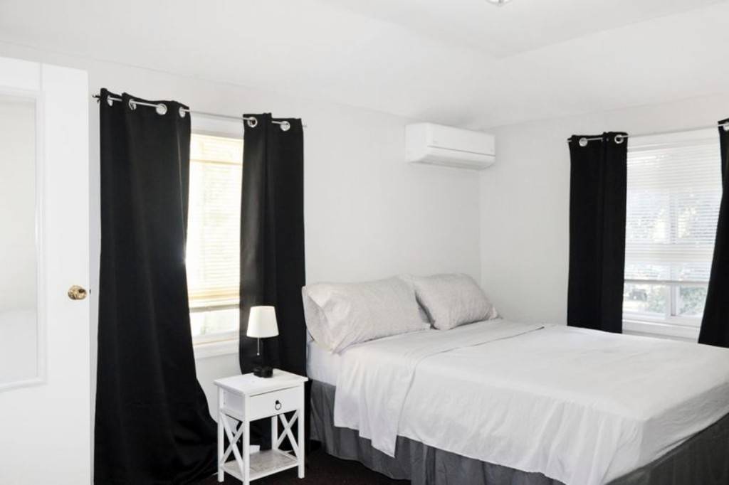 Welcome to 219 19 143rd Road, a well kept two family home offering space, versatility, and exceptional outdoor living.