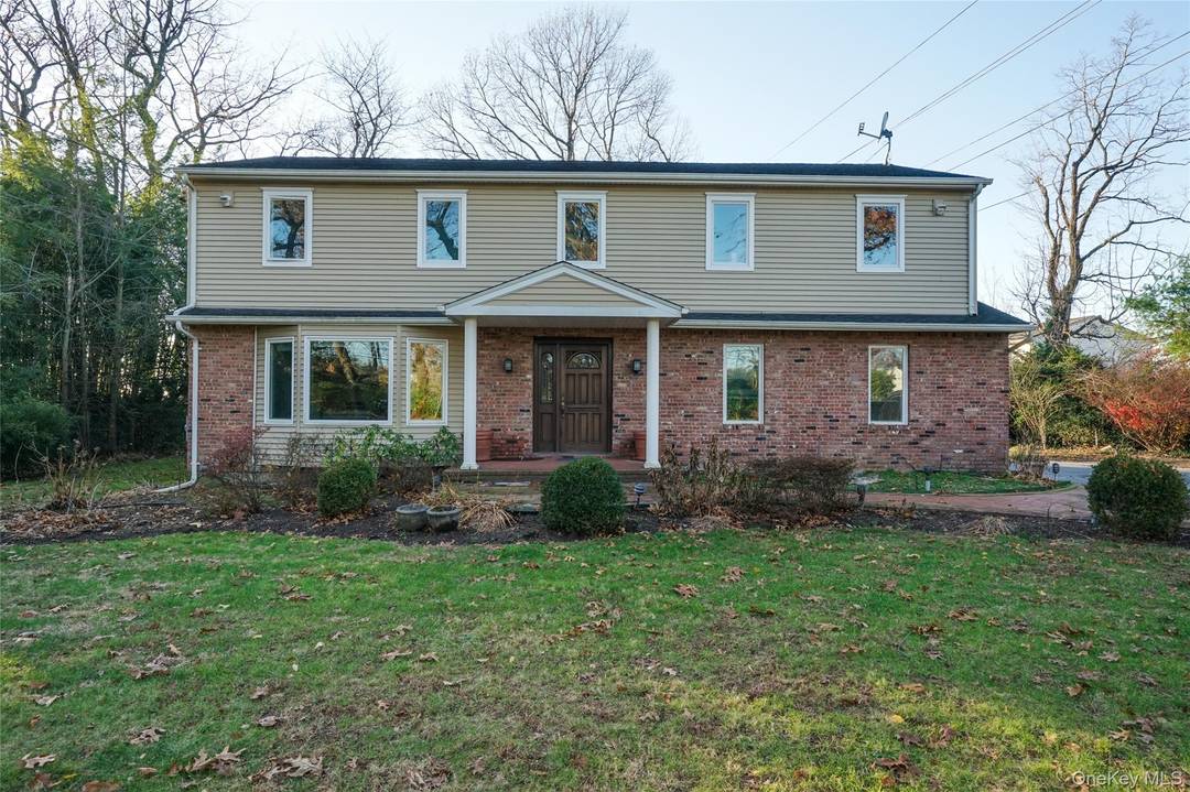 Spacious Colonial set back on a private one acre in the Village of Roslyn Harbor adjacent to the exclusive Engineers Country Club with unobstructed golf course views.