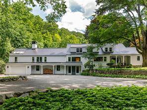 AVAILABLE JULY AND AUGUST 30, 000 MONTH Nestled across a private bridge, this chic 4 bedroom, 4400 sq ft farmhouse is a true oasis.