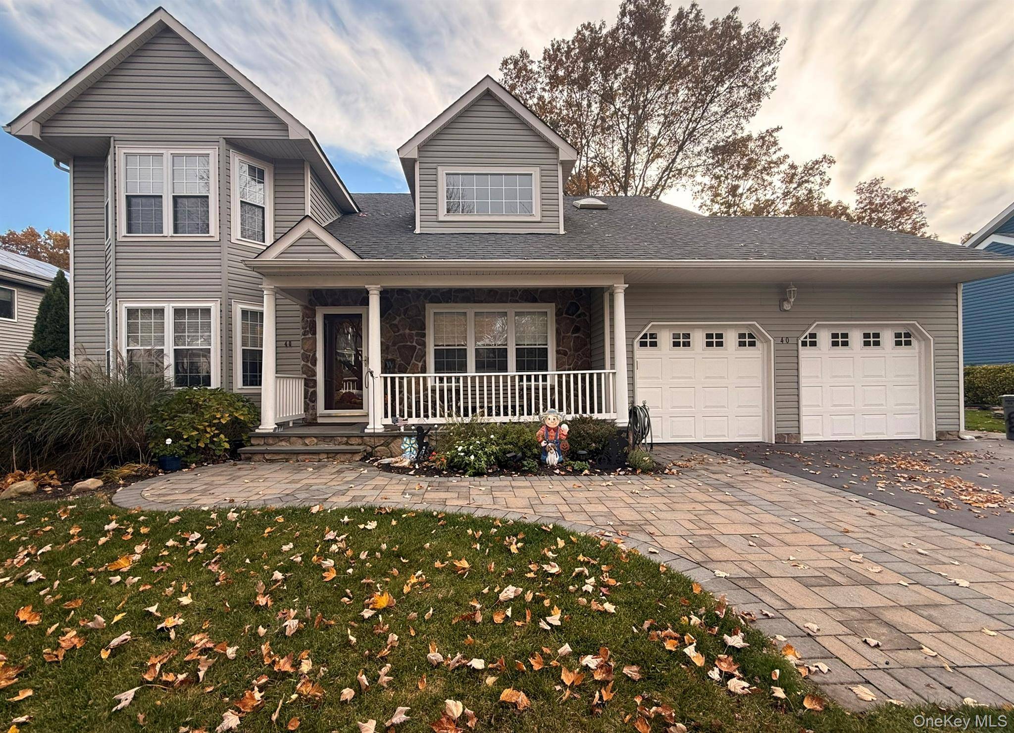 Beautifully Maintained 4 Bedroom Colonial in Desirable Kings Park Neighborhood Nestled on a quiet, tree lined street, this 4 Bedroom, 2.