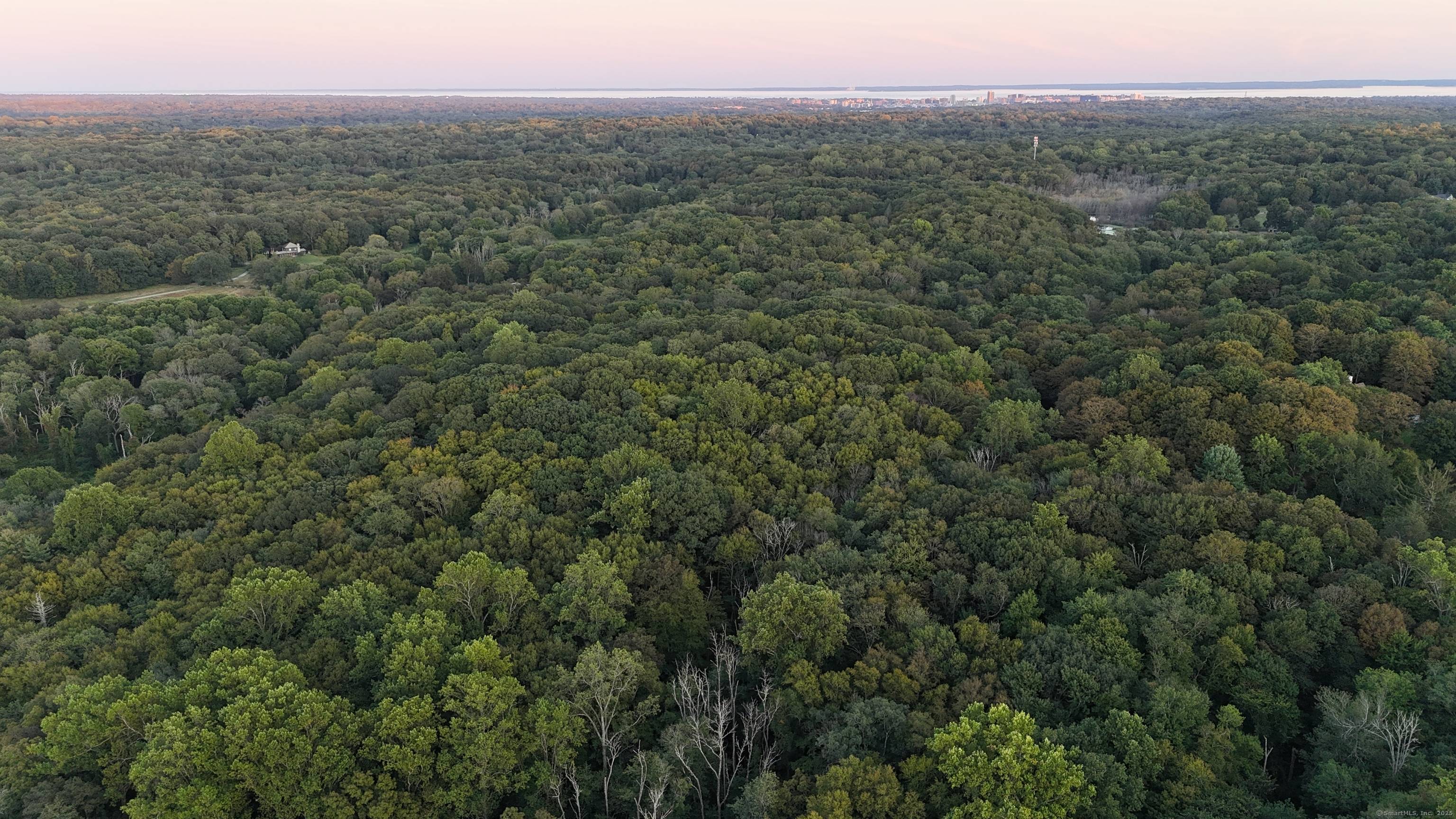 Rare Opportunity 14 Acres on the Greenwich Stamford Border Bordering the 900 acre Mianus River Gorge Preserve, this exceptional 14 acre property offers unmatched privacy and endless potential.
