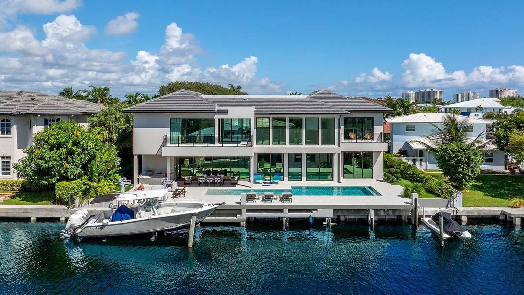 Like new modern waterfront estate in the coveted Lake Rogers community of East Boca Raton.