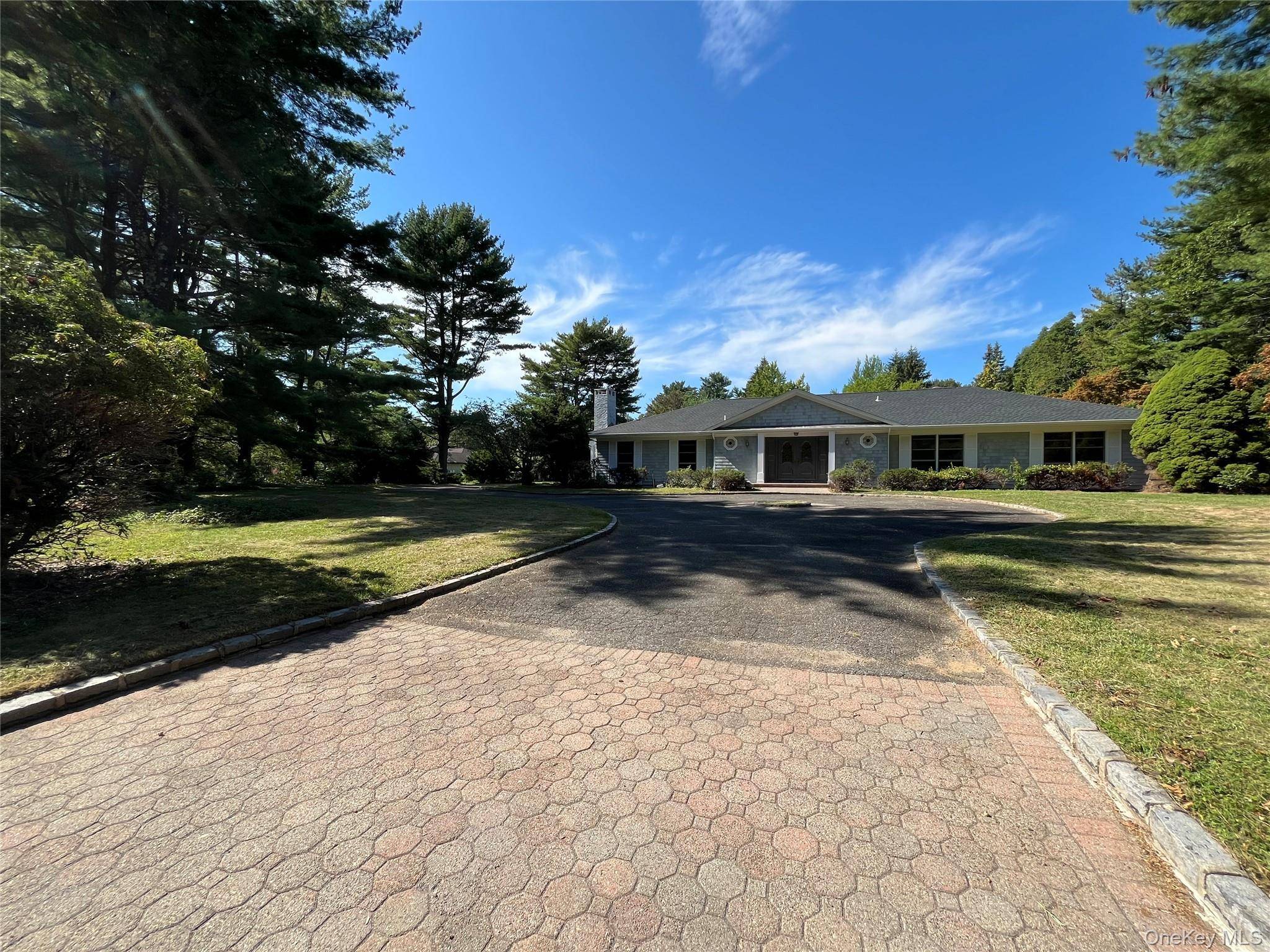 Welcome to this spacious and beautifully updated ranch style home set on a private country lane in Syosset Muttontown.