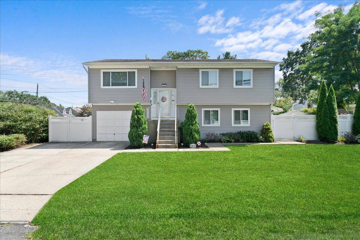Beautiful, Well Maintained Hi Ranch on Quiet Corner Lot Move In Ready !
