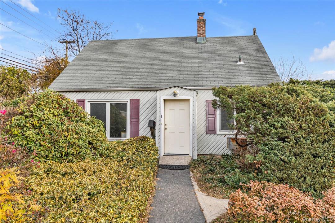 Levittown 3 bedroom 1 bath cape formerly used as an office.