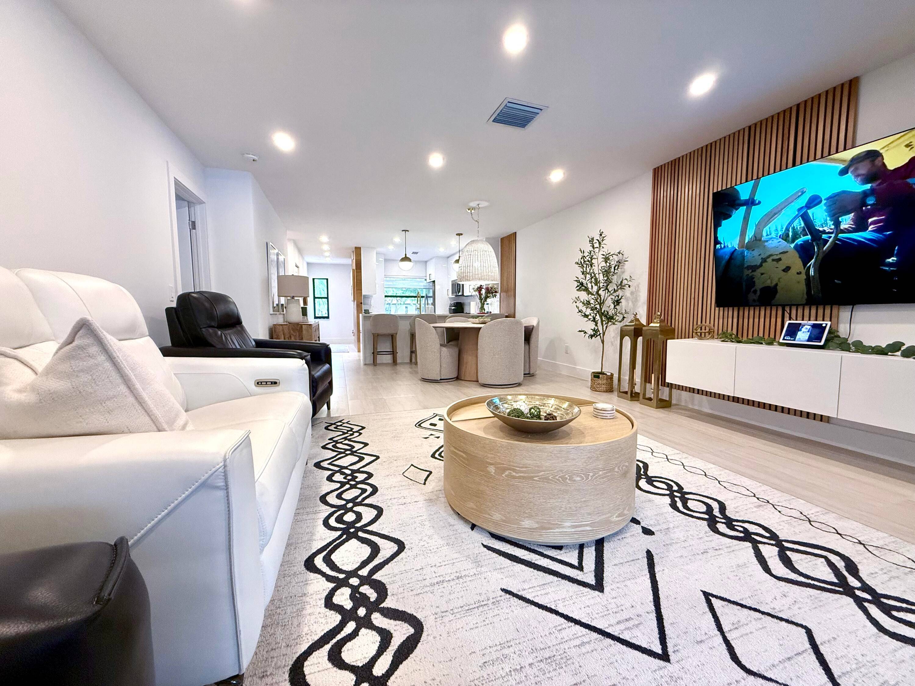 Tastefully renovated contemporary condo in a gated 55 community, offering tranquility with easy access to Boca Raton's best amenities and major roads.