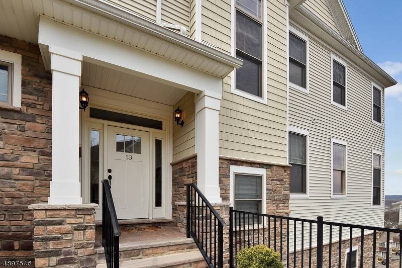 Welcome to an exceptional end unit townhouse in the prestigious Hidden Ridge at North Caldwell where warmth, style, and sophistication come together effortlessly.