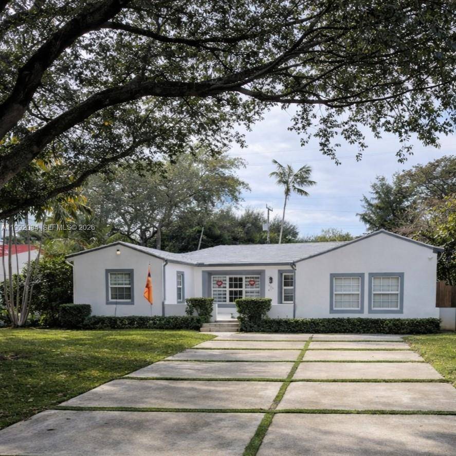 Set on a quiet street in the heart of Miami Shores, this beautifully updated residence blends timeless character with modern comfort.