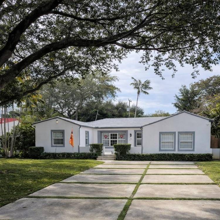 Set on a quiet street in the heart of Miami Shores, this beautifully updated residence blends timeless character with modern comfort.