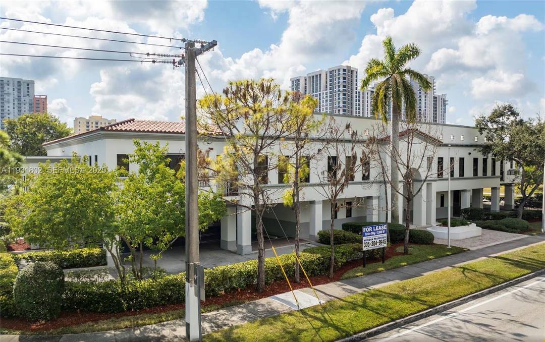 This meticulously maintained office building features an attractive fac ade with abundant windows, balconies, and professionally landscaped grounds designed to impress both employees and clients.