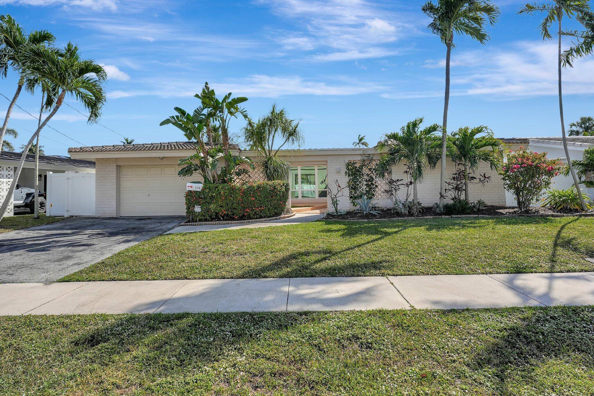 An exceptional waterfront property, nestled on one of the few tranquil, one sided waterfront streets in the highly desirable neighborhoods of Cypress Harbor, Cypress Isles, and Gardens Isles.