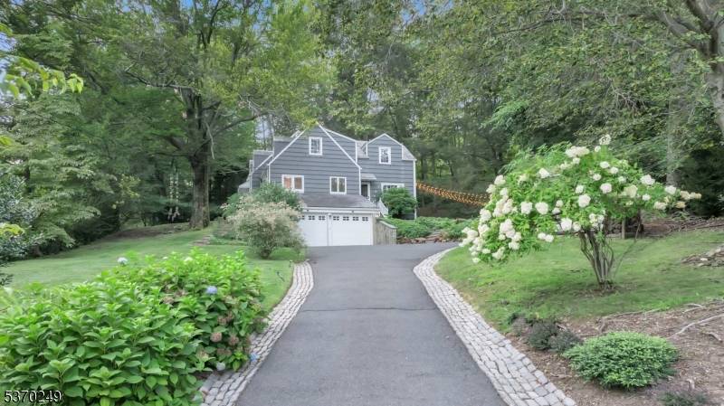 Located on one of MOUNTAINSIDE'S most desirable cul de sacs, this stunning custom Colonial Home spans three levels of beautifully finished living space.