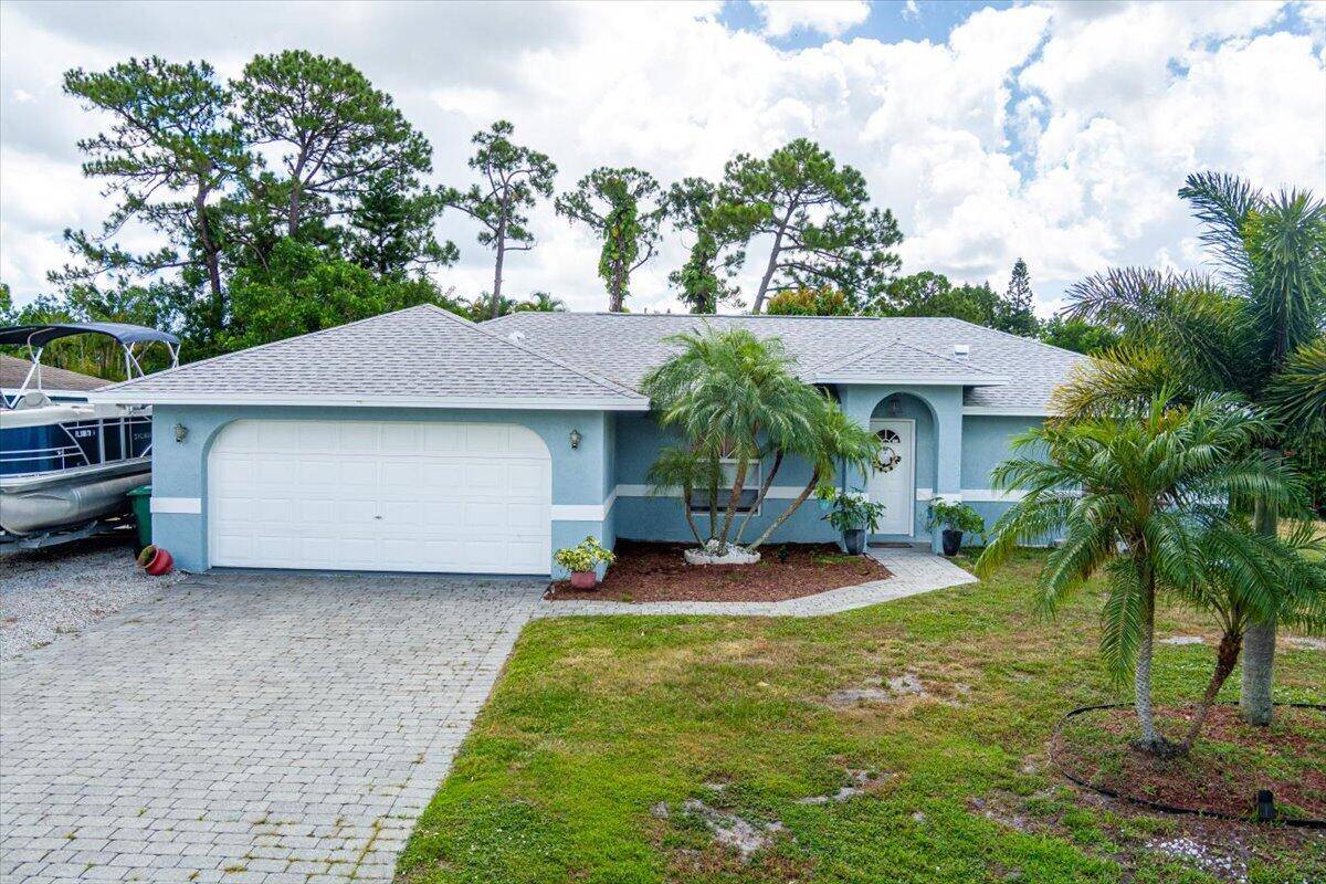 Beautifully maintained 3 bedroom, 2 bath, 2 car garage CBS home on a quiet street just off Crosstown Parkway in the heart of Port Saint Lucie !