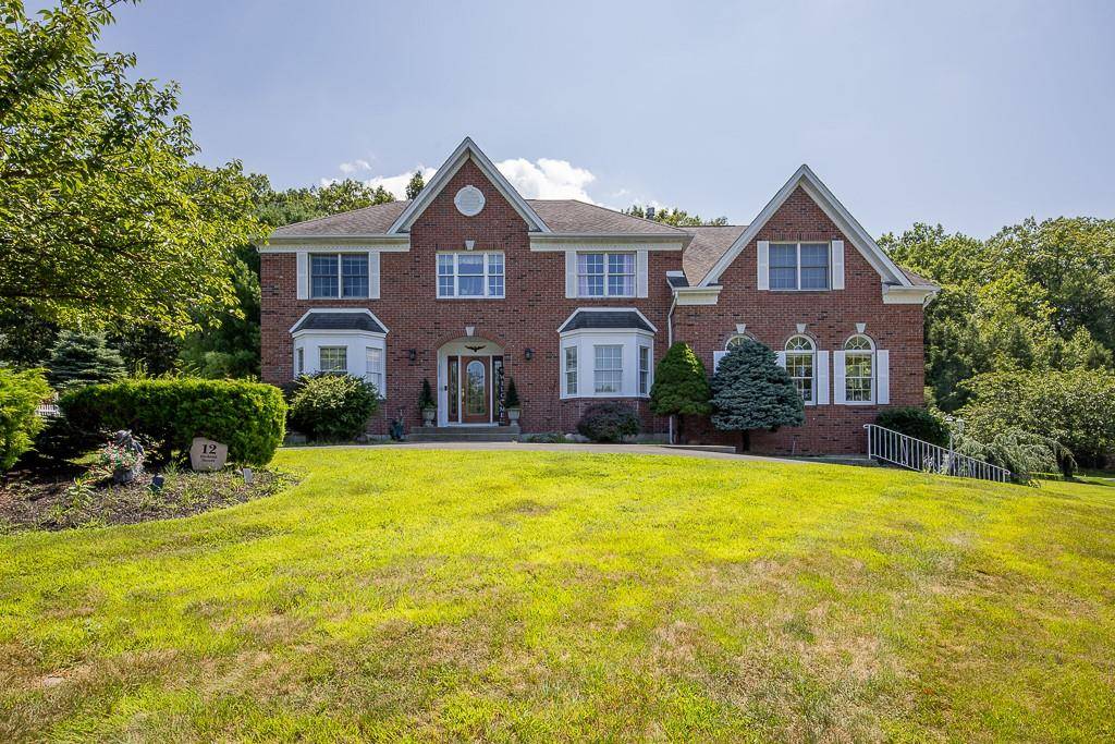 Welcome to this beautifully maintained center hall Colonial, offering breathtaking panoramic mountain views and timeless elegance throughout.