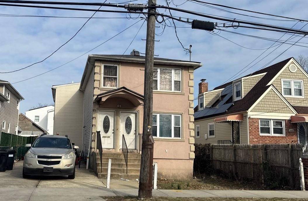 This Duplex Style Home Features 6 Bedrooms, 3 Full Baths and driveway parking.