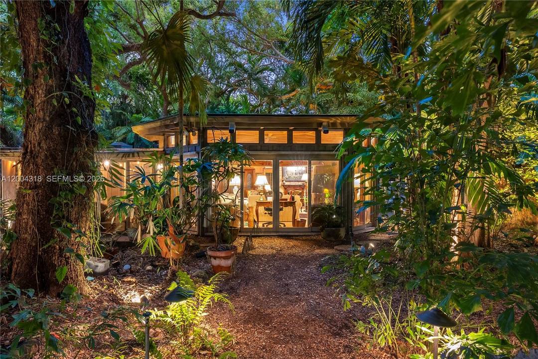 Tucked along one of Coconut Grove s most coveted streets, this enchanting cottage offers a rare blend of charm and privacy.