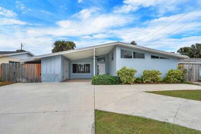 This beautifully upgraded vaulted ceiling mid century single family home in Palm Beach Gardens features 3 bedrooms and 2 bathrooms, with no HOA fees.