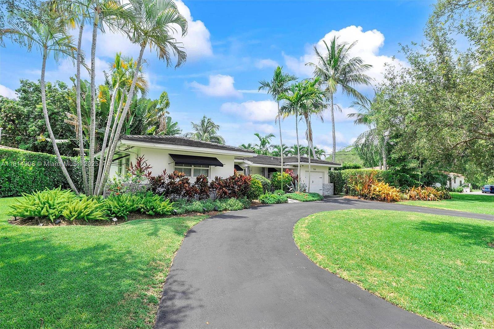 This beautifully updated home blends modern elegance with tropical charm, creating a true sanctuary.