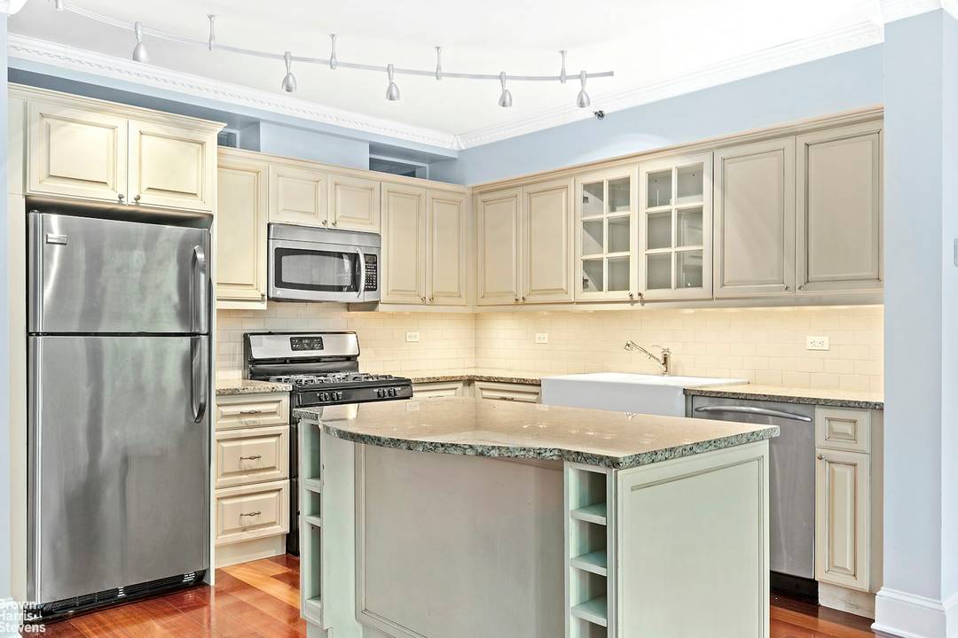 Unobstructed Morningside Park views from a 28 foot wide wall of floor to ceiling windows !